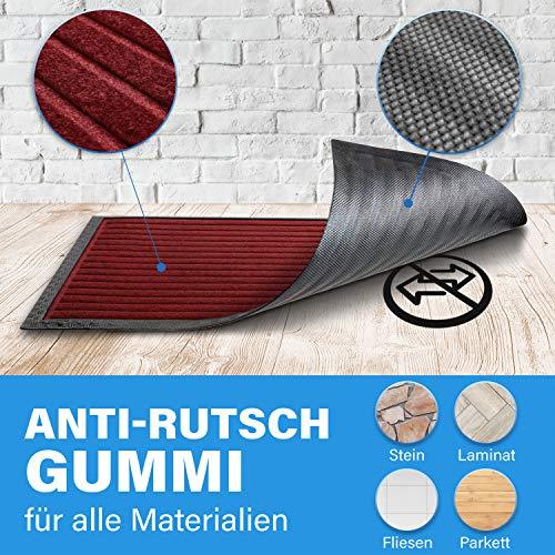 Dunkelrote Fussmatte mit Anti Rutsch Gummi und strukturierter Oberflaeche, geeignet fuer Stein, Laminat, Fliesen und Parkett.