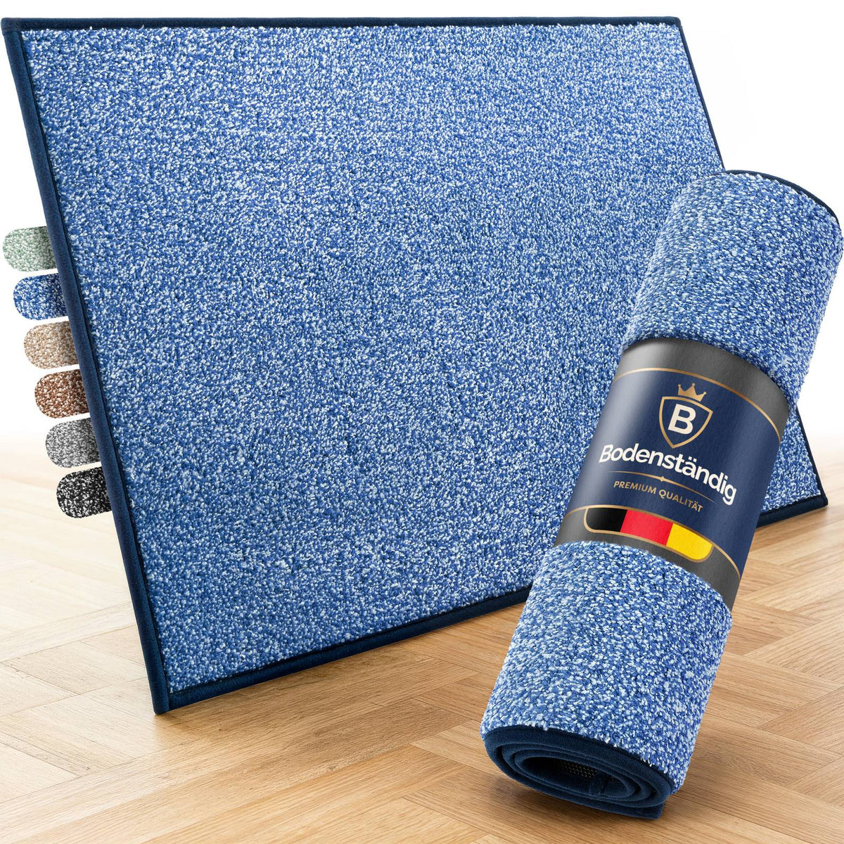 Blaue Fußmatte auf Parkett, daneben eine aufgerollte Matte mit Bodenständig-Banderole und Farbmuster in sechs Farben