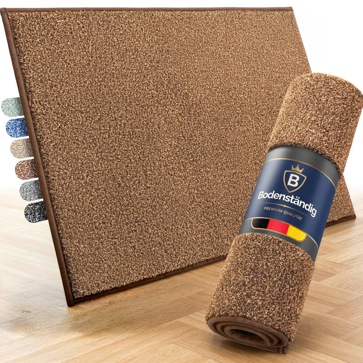 Braune Fußmatte von Bodenständig, daneben eine aufgerollte Matte mit Etikett und sechs Farbmustern auf Parkettboden