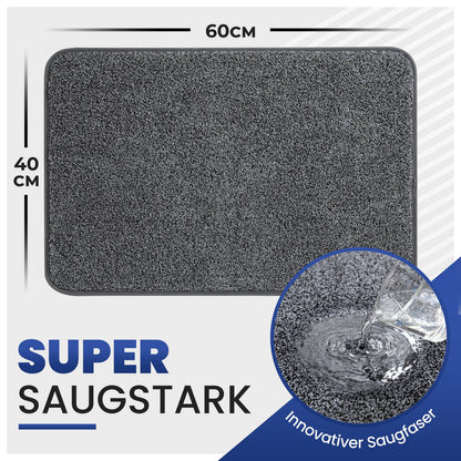 Graue Fußmatte, 60 x 40 cm, mit Wasser, das in die Faser einzieht, und dem Text „Super saugstark“