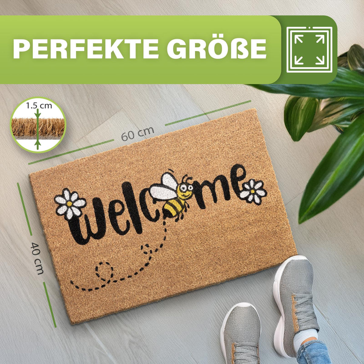 Kokos Fußmatte mit Schriftzug Welcome, Biene und Gänseblümchen, Maße 60 x 40 cm, 1,5 cm dick, auf Boden mit Pflanze