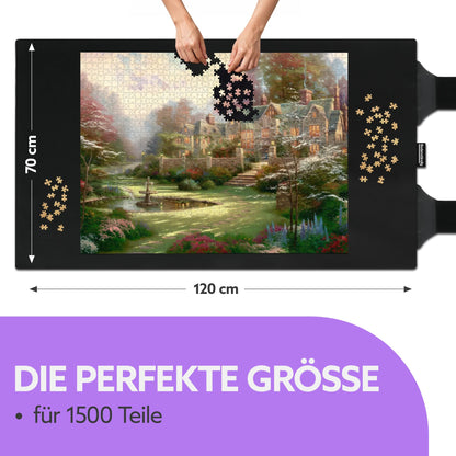 Schwarze Puzzlematte 70 x 120 cm mit Landhaus-Puzzle, Händen und Teilen, Text: Die perfekte Größe für 1500 Teile