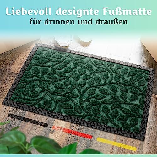 Die liebevoll designte grüne Fußmatte eignet sich für drinnen und draußen und sorgt im Eingangsbereich für einen stilvollen Gesamteindruck.
