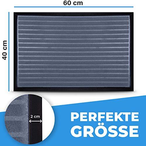 Graue Fussmatte 60x40 cm mit streifenstruktur und 2-cm Randdetail, perfekt fuer kleine Eingangsbereiche.